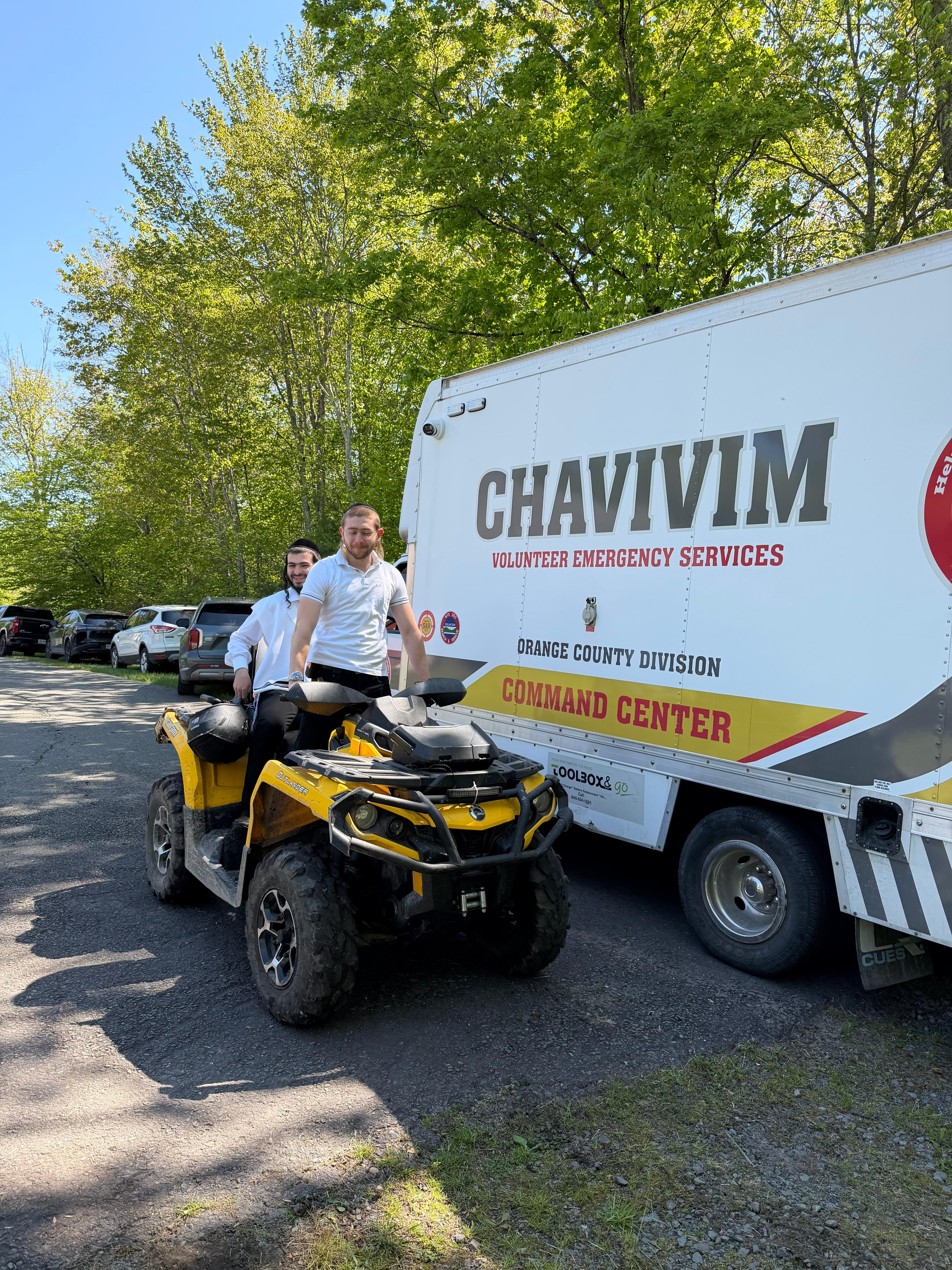 Two Chavivim members with the SAR ATV staged in front of the KJ-500 Command Center truck